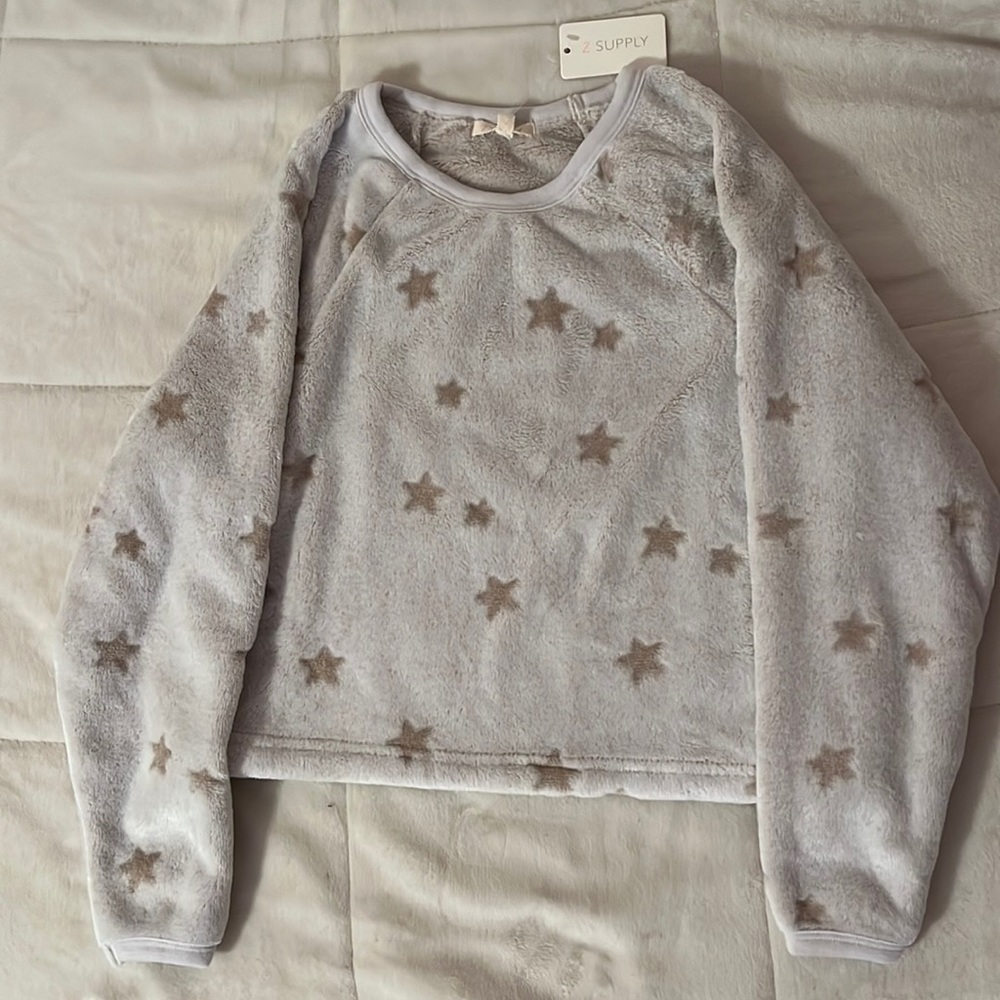 A gray sweater with a soft touch and light brown colored stars all over